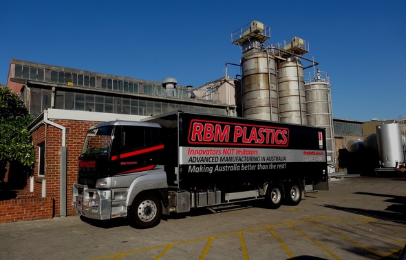 RBM Plastics signed truck in front of RBM's ndustrial site